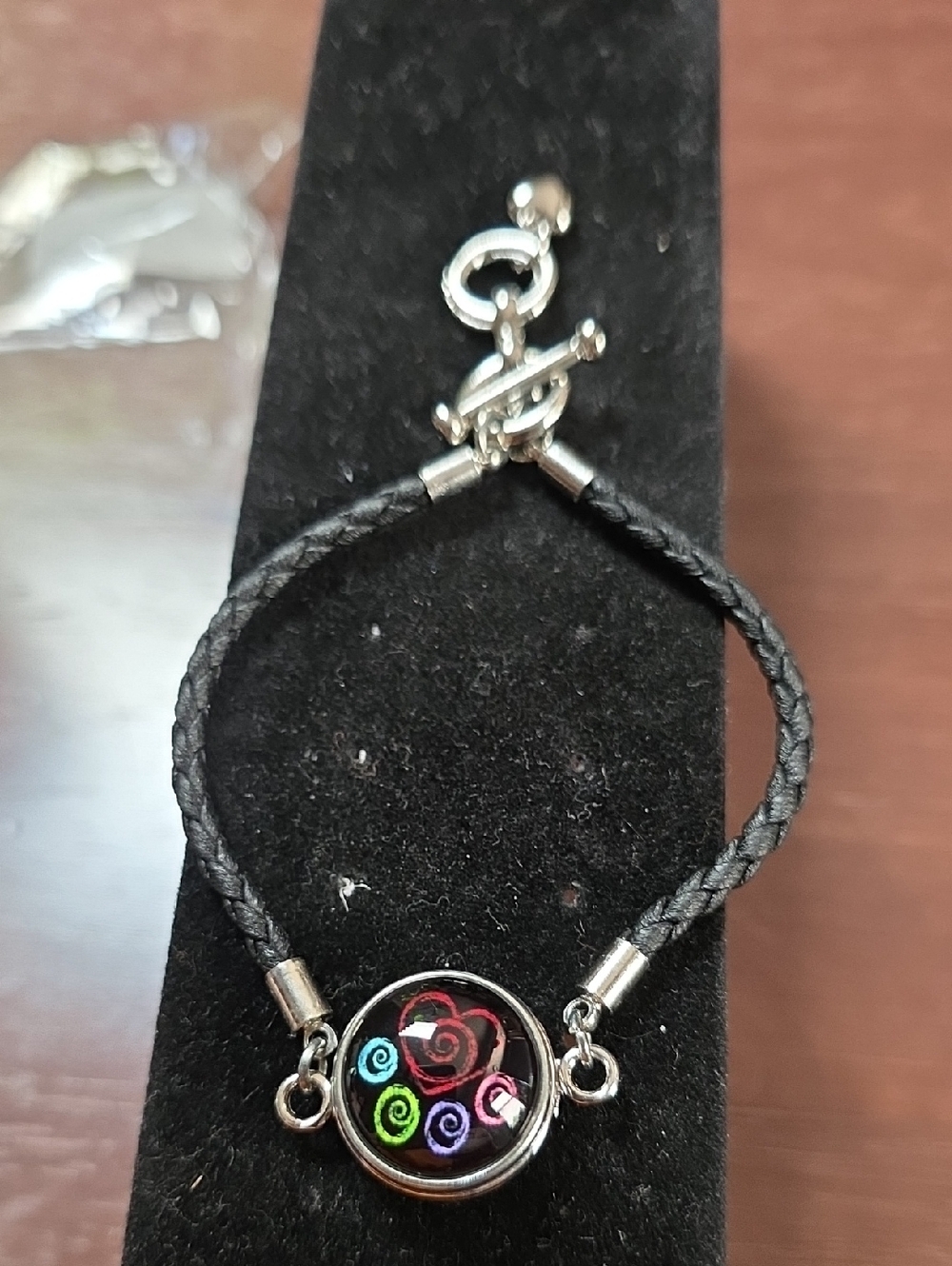 Source Unknown Black Braided Bracelet with Multicolor Swirl Charm